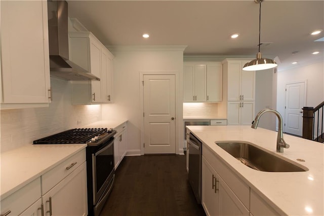 709 Dodd Ln Unit 165, Buford, GA 30518 - kitchen with wall chimney range hood, a sink, stainless steel appliances, white cabinets, and tasteful backsplash