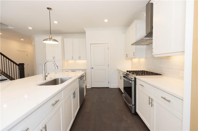 709 Dodd Ln Unit 165, Buford, GA 30518 - kitchen featuring wall chimney exhaust hood, appliances with stainless steel finishes, a sink, decorative backsplash, and white cabinets