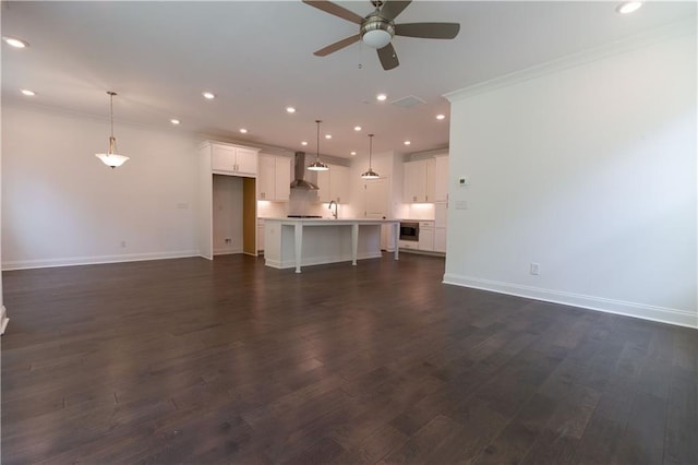 709 Dodd Ln Unit 165, Buford, GA 30518 - unfurnished living room featuring ceiling fan, baseboards, ornamental molding, dark wood finished floors, and recessed lighting