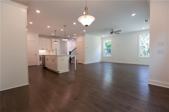 709 Dodd Ln Unit 165, Buford, GA 30518 - kitchen featuring ceiling fan, light countertops, a kitchen island with sink, a sink, and white cabinets