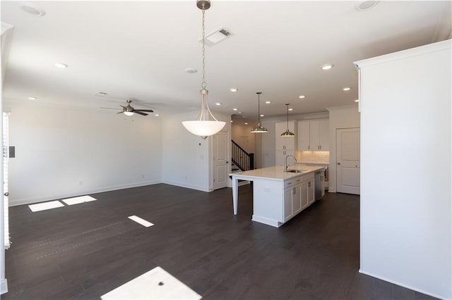 709 Dodd Ln Unit 165, Buford, GA 30518 - kitchen featuring a sink, dishwasher, a ceiling fan, baseboards, and white cabinetry