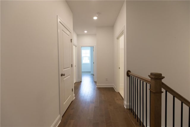 709 Dodd Ln Unit 165, Buford, GA 30518 - corridor featuring dark wood-type flooring, recessed lighting, baseboards, and an upstairs landing