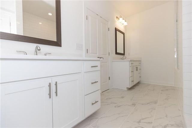 709 Dodd Ln Unit 165, Buford, GA 30518 - bathroom with vanity, marble look tile flooring, recessed lighting, and baseboards