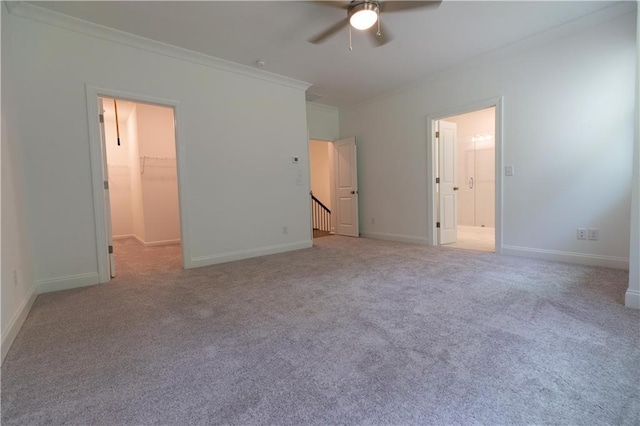 709 Dodd Ln Unit 165, Buford, GA 30518 - unfurnished bedroom with a walk in closet, crown molding, carpet, and baseboards