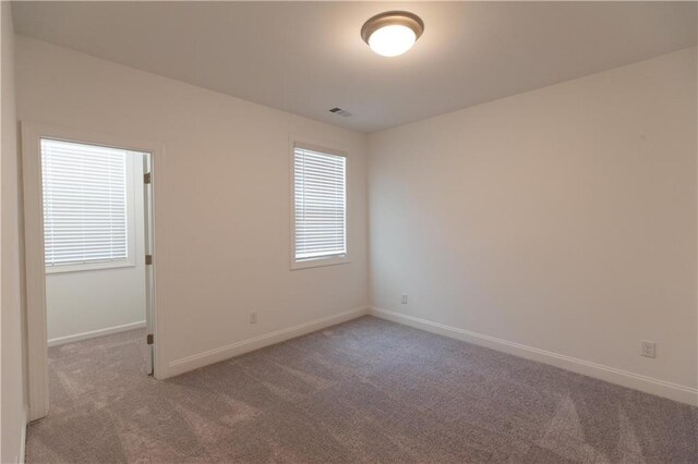 709 Dodd Ln Unit 165, Buford, GA 30518 - carpeted empty room featuring baseboards