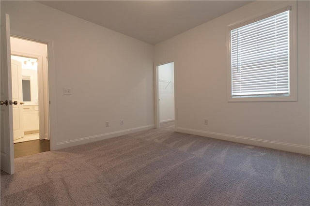 709 Dodd Ln Unit 165, Buford, GA 30518 - carpeted spare room with baseboards