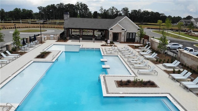 709 Dodd Ln Unit 165, Buford, GA 30518 - community pool with view of scattered trees and a patio
