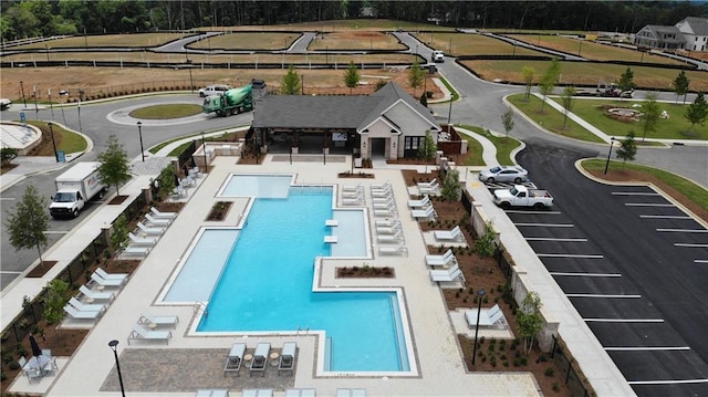 709 Dodd Ln Unit 165, Buford, GA 30518 - view of swimming pool with view of wooded area