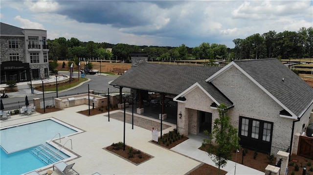 709 Dodd Ln Unit 165, Buford, GA 30518 - community pool featuring a patio