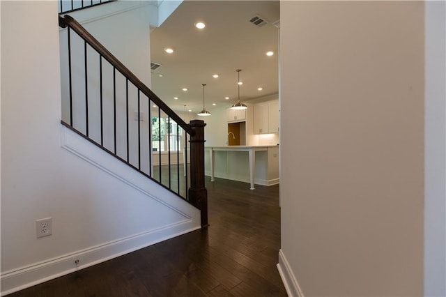 709 Dodd Ln Unit 165, Buford, GA 30518 - staircase featuring recessed lighting, wood finished floors, and baseboards