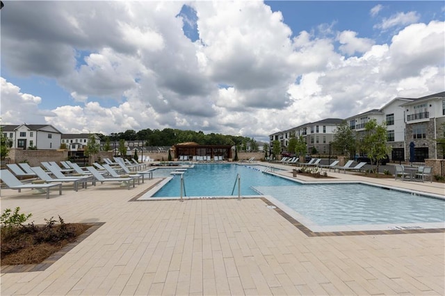 709 Dodd Ln Unit 165, Buford, GA 30518 - community pool with a patio area and a residential view