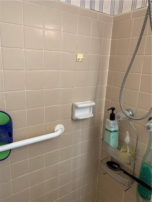 bathroom with a tile shower