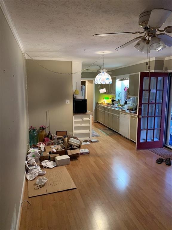 kitchen with crown molding, ceiling fan, white dishwasher, a textured ceiling, and light wood-type flooring