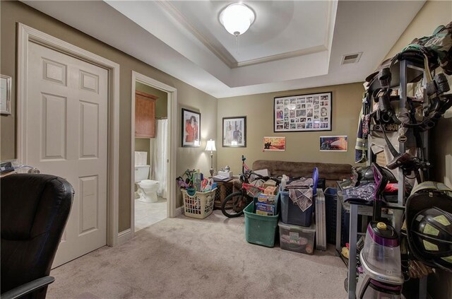 home office featuring carpet, a raised ceiling, and baseboards