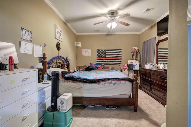 bedroom featuring carpet, crown molding, and a ceiling fan