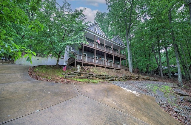 rear view of property with covered porch