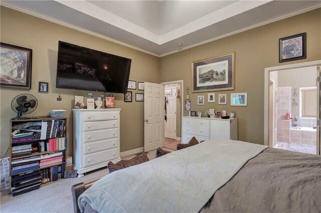 bedroom featuring crown molding, carpet, ensuite bath, and baseboards