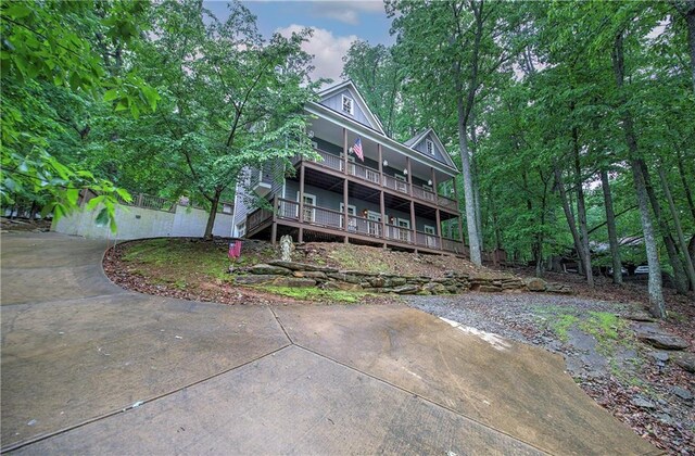 rear view of property with covered porch