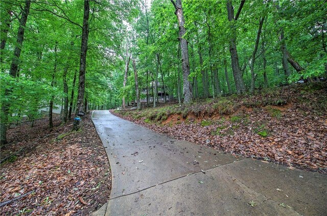 surrounding community featuring a forest view