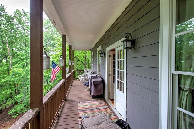 deck with a porch and area for grilling