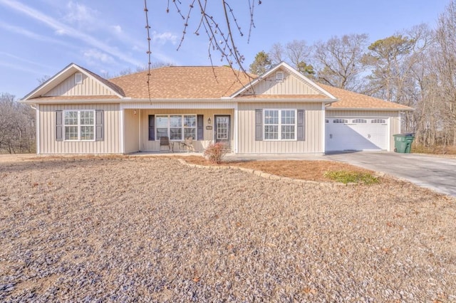 ranch-style home with a garage and a porch