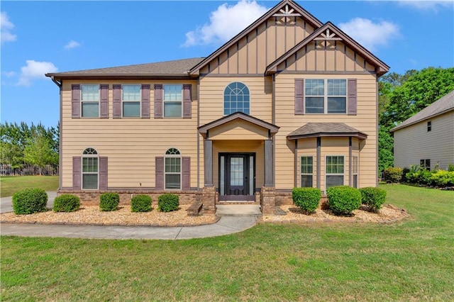 craftsman inspired home featuring board and batten siding and a front lawn