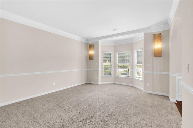 unfurnished room featuring baseboards, ornamental molding, carpet flooring, and visible vents