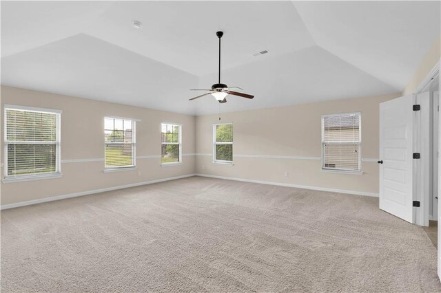 interior space with ceiling fan, light carpet, and lofted ceiling