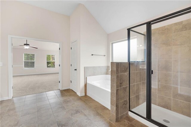 bathroom featuring tile patterned flooring, a ceiling fan, a shower stall, vaulted ceiling, and a bath