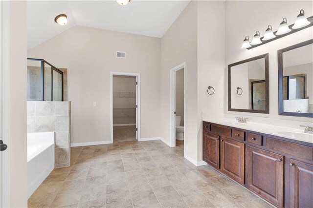 full bathroom with visible vents, a garden tub, a stall shower, and toilet
