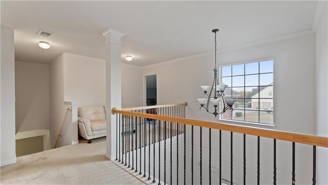 hall with crown molding, light carpet, and a chandelier