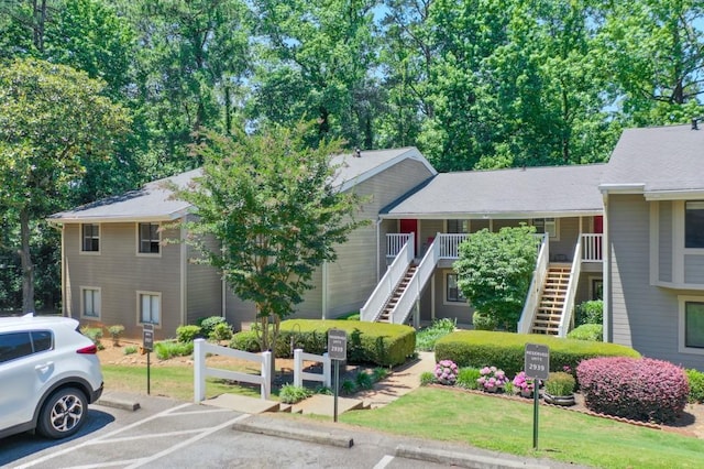 2937 Torreya Way, Marietta, GA 30067 - view of front facade featuring stairs, uncovered parking, and a front yard