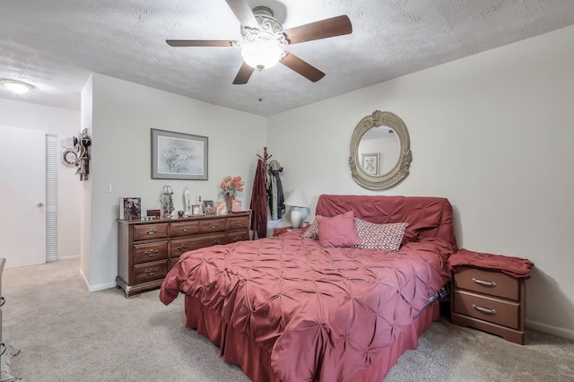 2937 Torreya Way, Marietta, GA 30067 - bedroom featuring light colored carpet, a textured ceiling, baseboards, and a ceiling fan