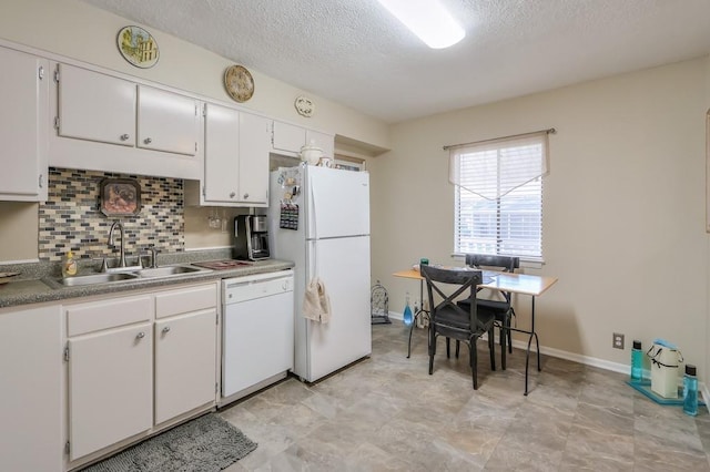 kitchen with white cabinetry, white appliances, a textured ceiling, and a sink