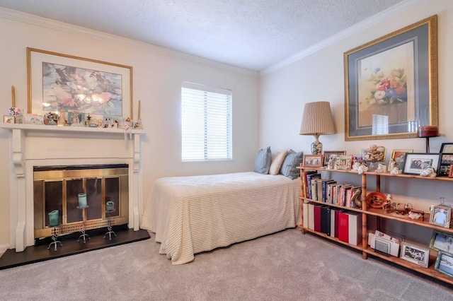 bedroom featuring carpet, crown molding, and a glass covered fireplace