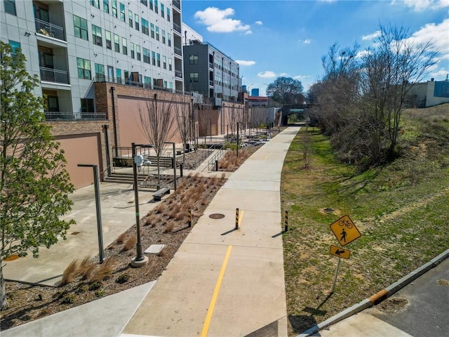 view of property's community featuring fence