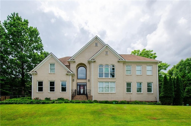 view of front of property with a front lawn