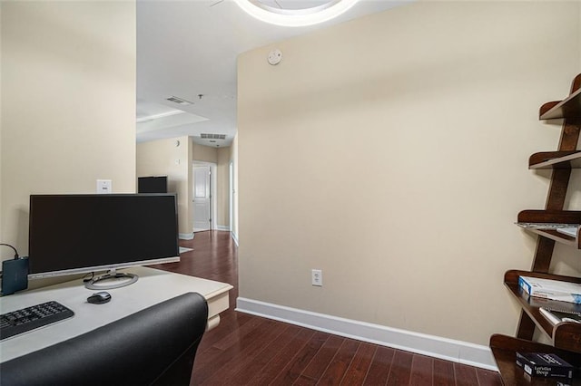 office space featuring dark wood-type flooring and baseboards