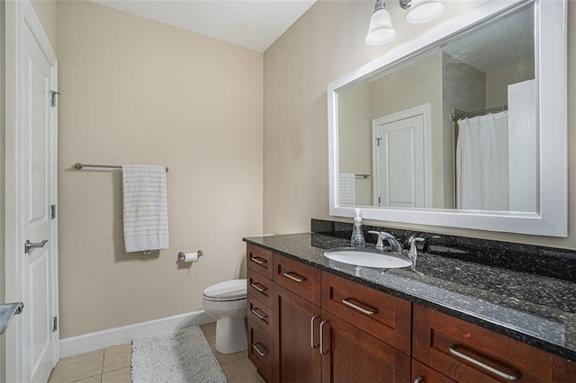 bathroom with tile patterned floors, baseboards, vanity, toilet, and curtained shower