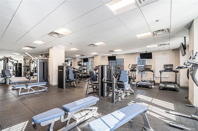 gym featuring a paneled ceiling