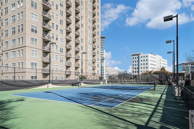 view of tennis court with fence