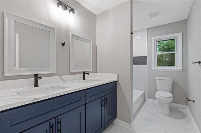 679 Creek View Dr, Lawrenceville, GA 30044 - bathroom featuring double vanity, toilet, marble finish floors, baseboards, and shower / tub combination