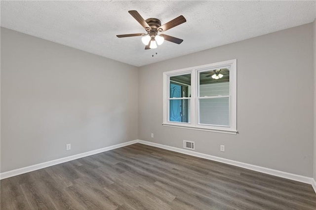 679 Creek View Dr, Lawrenceville, GA 30044 - empty room featuring dark wood-type flooring, baseboards, a ceiling fan, and a textured ceiling