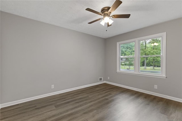 679 Creek View Dr, Lawrenceville, GA 30044 - spare room with dark wood-type flooring, baseboards, ceiling fan, and a textured ceiling