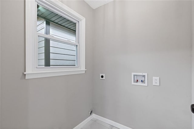 679 Creek View Dr, Lawrenceville, GA 30044 - laundry area featuring electric dryer hookup, baseboards, and washer hookup
