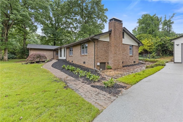 679 Creek View Dr, Lawrenceville, GA 30044 - view of property exterior featuring brick siding, a chimney, and a yard