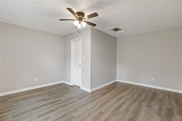 679 Creek View Dr, Lawrenceville, GA 30044 - empty room featuring wood finished floors, a ceiling fan, baseboards, and a textured ceiling