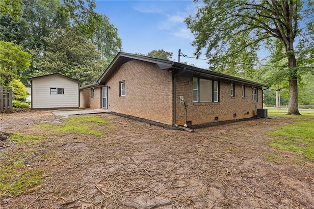 679 Creek View Dr, Lawrenceville, GA 30044 - view of side of property with crawl space, brick siding, and central air condition unit