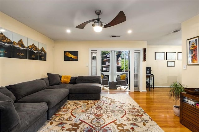1445 Monroe Dr NE Unit 14B, Atlanta, GA 30324 - living area featuring ceiling fan, wood finished floors, and recessed lighting