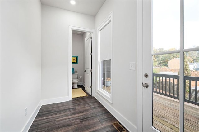 doorway to outside with dark hardwood / wood-style flooring